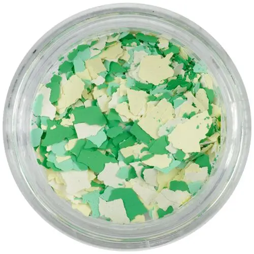 Randomly shaped confetti flakes – white, yellow, green